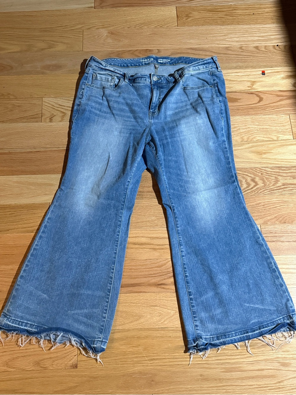 torrid Light Wash Blue Flared Jeans with Raw Hem